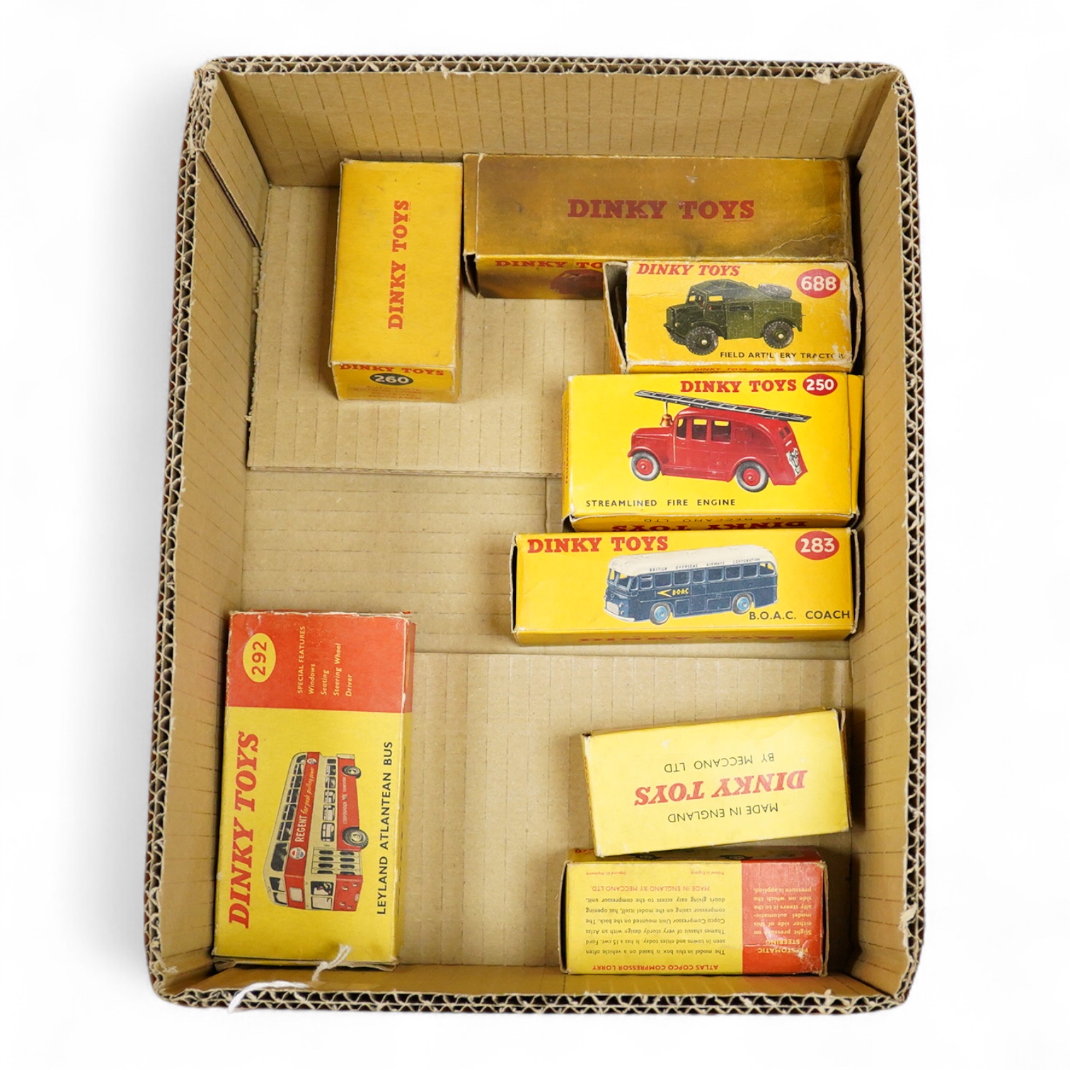 Eight boxed Dinky Toys; Royal Mail van (260), Leyland Atlantean bus (292), Atlas Copco Compressor Lorry (436), Standard Atlas Kenebrake (295), BOAC coach (283), Streamlined Fire Engine (250), Field Artillery Tractor (688